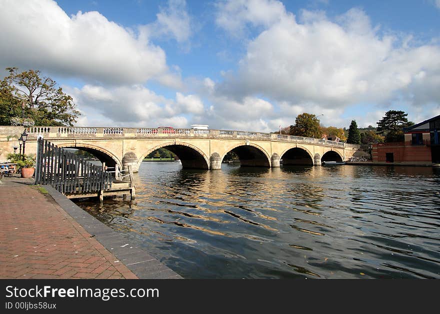 Early Autumn by the River Thames in England with Henley Road Bridge in the background. Early Autumn by the River Thames in England with Henley Road Bridge in the background