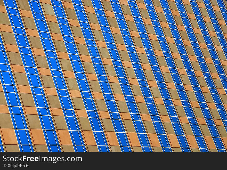 High rise hotel with blue windows at an angle