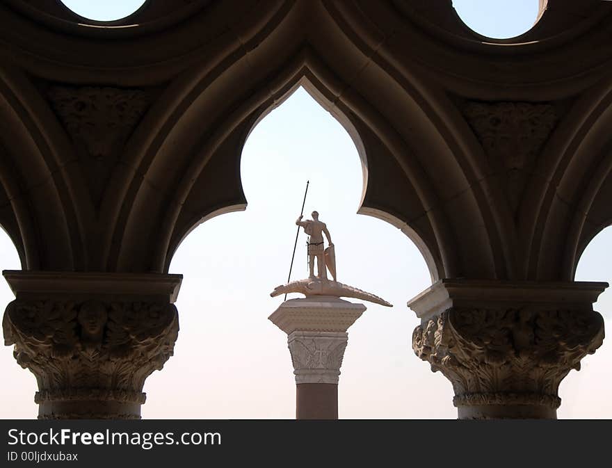 Statue of Saint George the dragonslayer framed in arch