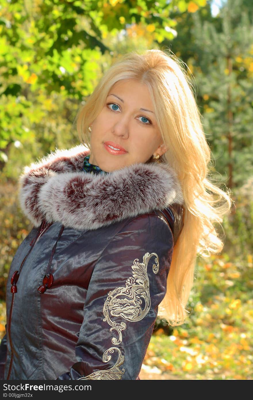 Beautiful blond woman in autumn forest. Beautiful blond woman in autumn forest