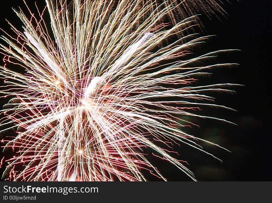 Bright white light of fireworks exploding against the night sky on the 4th of July. Bright white light of fireworks exploding against the night sky on the 4th of July