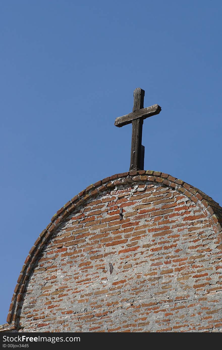 Wooden Cross On Building