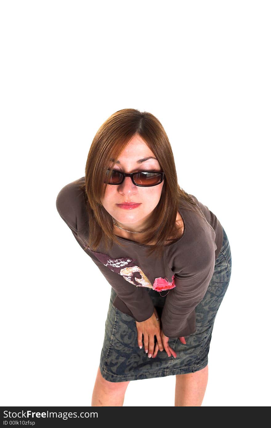 Woman with a fashion pose shot over white backdrop. Woman with a fashion pose shot over white backdrop