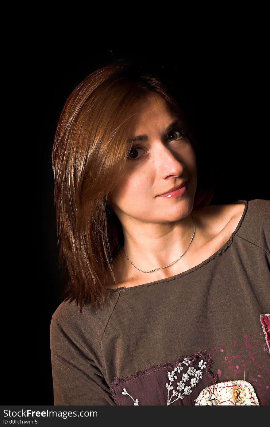 Woman with a fashion pose shot over black backdrop. Woman with a fashion pose shot over black backdrop