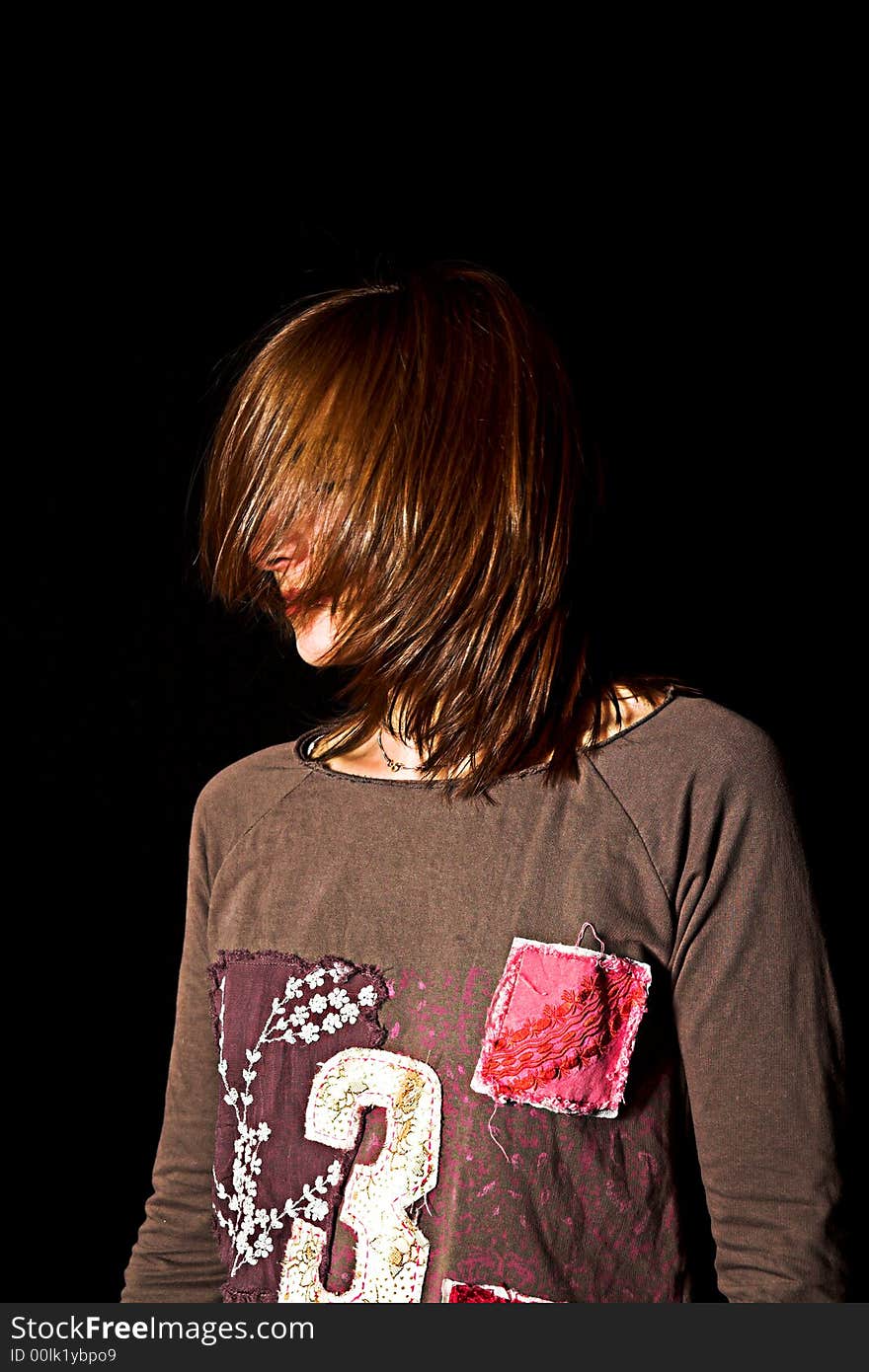 Woman with a fashion pose shot over black backdrop. Woman with a fashion pose shot over black backdrop