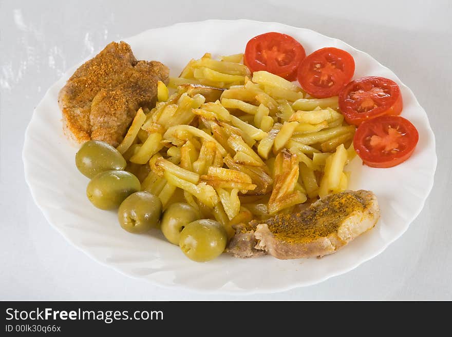 Pork chop with fried potatoes on plate. Pork chop with fried potatoes on plate