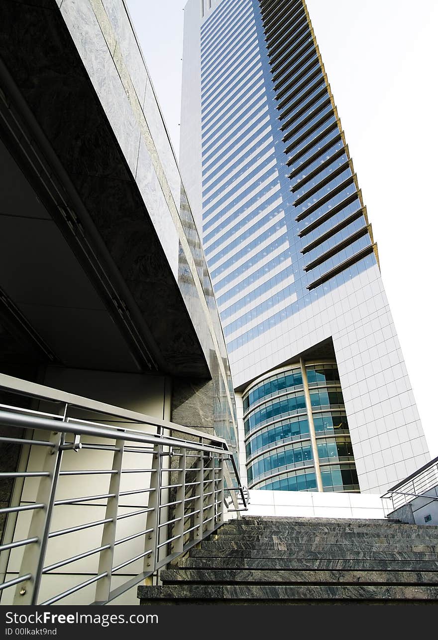 Stairway leading up to a modern office building in busy metropolis. Stairway leading up to a modern office building in busy metropolis