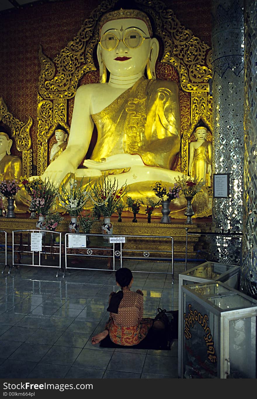 A woman praying the TheBuddha with Glasses. This Buddha have glasses because All The people around Myanmar who are wearing glasses come here to ask to the Buddha to take off forever glasses. In the Room there is a box with hundred of glasses of the people who have received this desire and took off the glasses forever. The Buddha' s glasses are been donated from a man who was one of the first to take off glasses after praying. A woman praying the TheBuddha with Glasses. This Buddha have glasses because All The people around Myanmar who are wearing glasses come here to ask to the Buddha to take off forever glasses. In the Room there is a box with hundred of glasses of the people who have received this desire and took off the glasses forever. The Buddha' s glasses are been donated from a man who was one of the first to take off glasses after praying