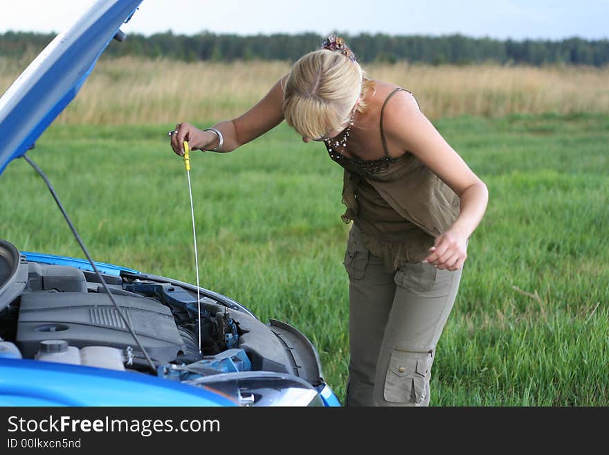 Woman with her broken car.