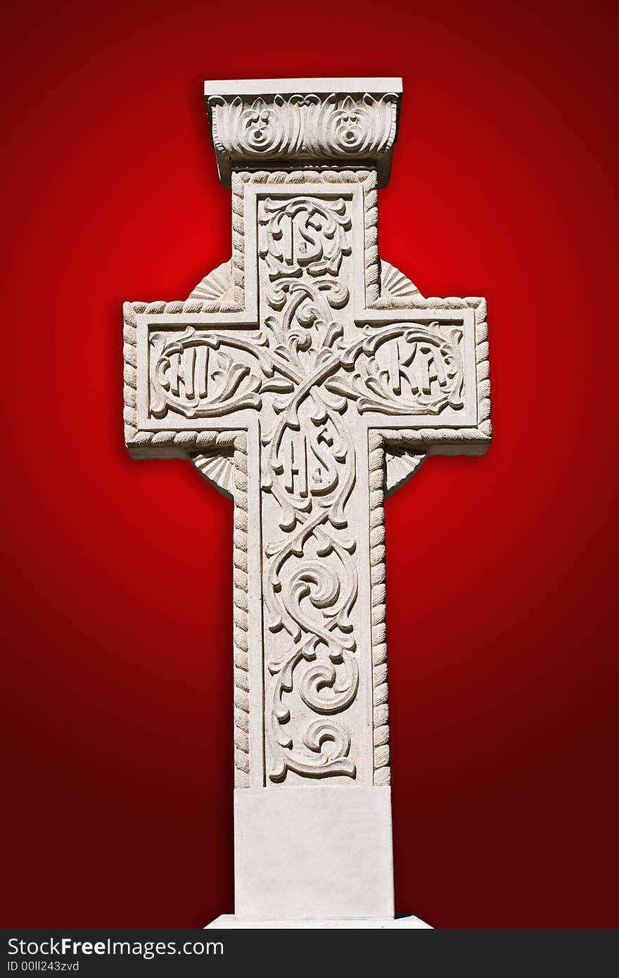 Old ancient stone cross on red background. Old ancient stone cross on red background