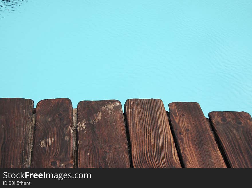 Standing at the edge of the pool side. Standing at the edge of the pool side