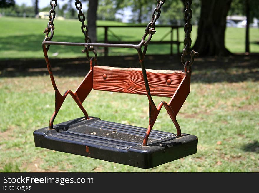 Swing in green playground park