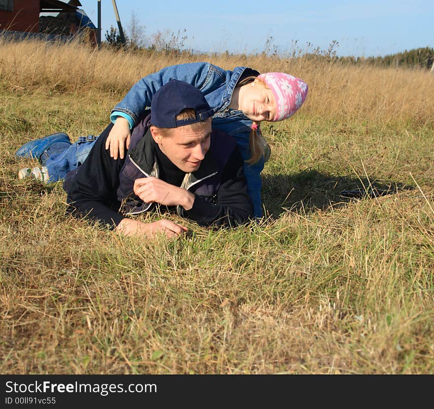 Father with daughter on pratum