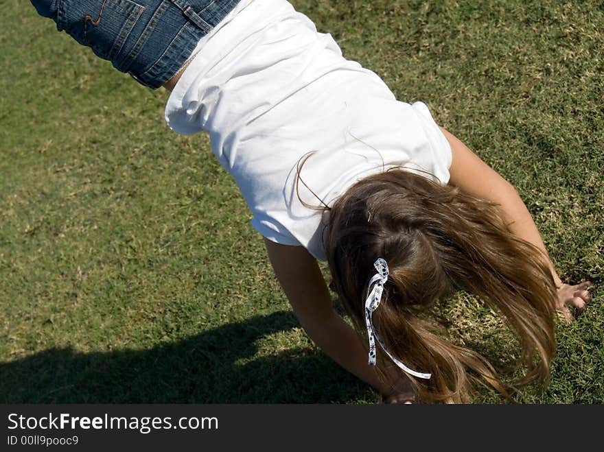 Young girl doing a handstand