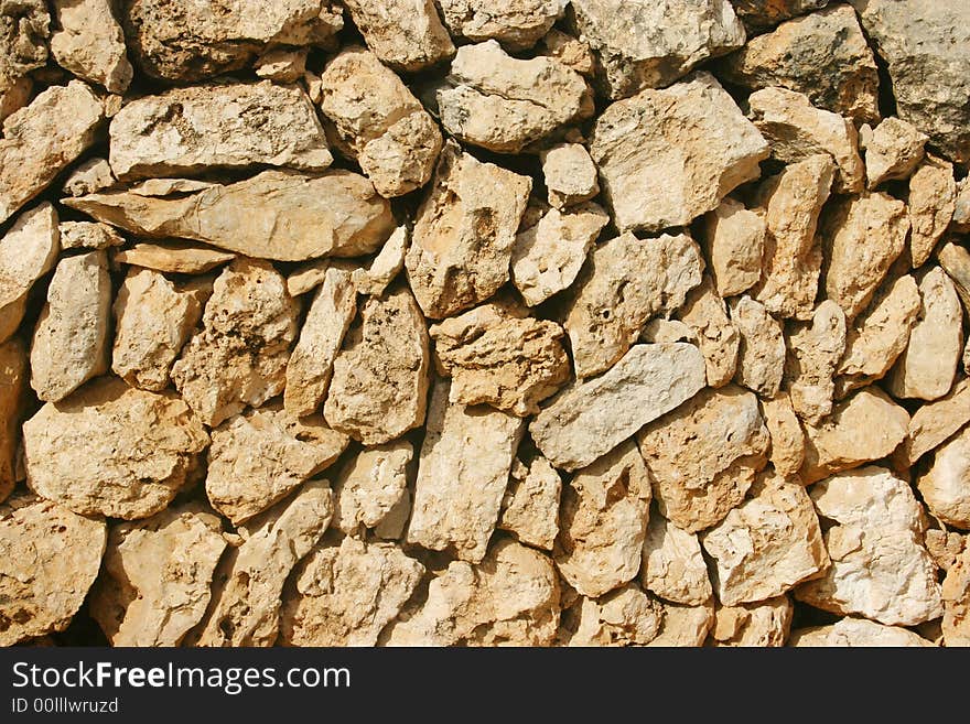 Background of a brown mediterranean stone wall