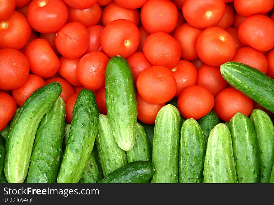 Tomatoes and cucumbers lying together ). Tomatoes and cucumbers lying together )