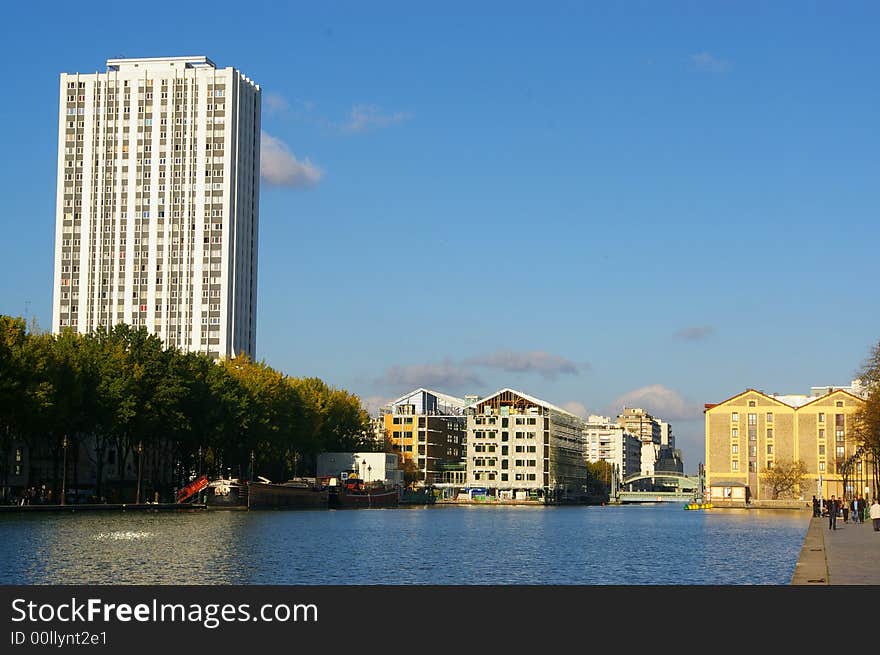 A french canal located in Paris, at the end of an autumnal afternoon. A french canal located in Paris, at the end of an autumnal afternoon.