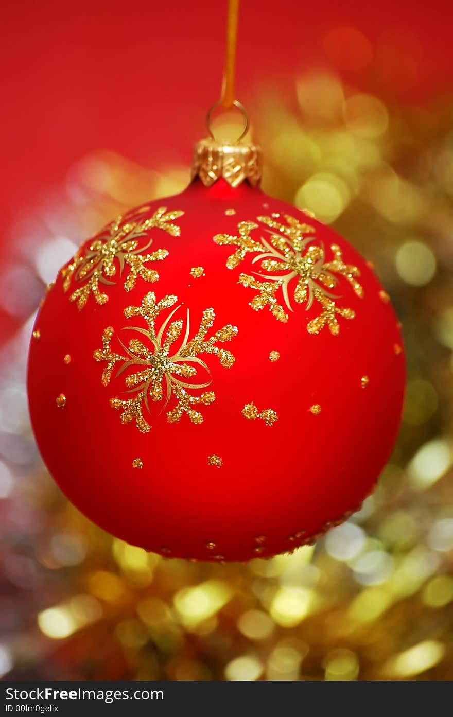 Red christmas ball on a colorful blur background