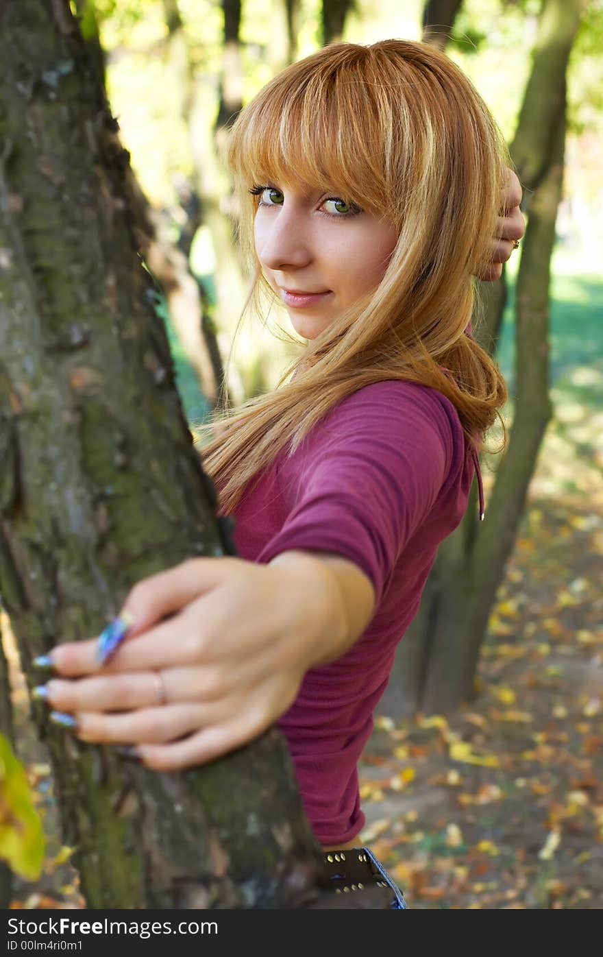 Slim cute blond girl in the autumn park. Slim cute blond girl in the autumn park