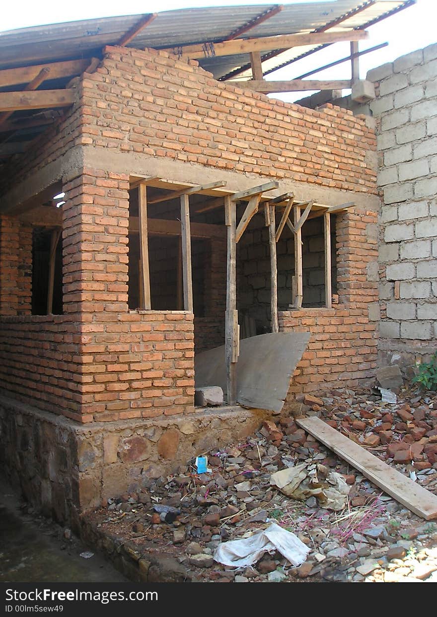 Within the ruins of an older brick school, a new building is being built in Kigali Rwanda. Within the ruins of an older brick school, a new building is being built in Kigali Rwanda.