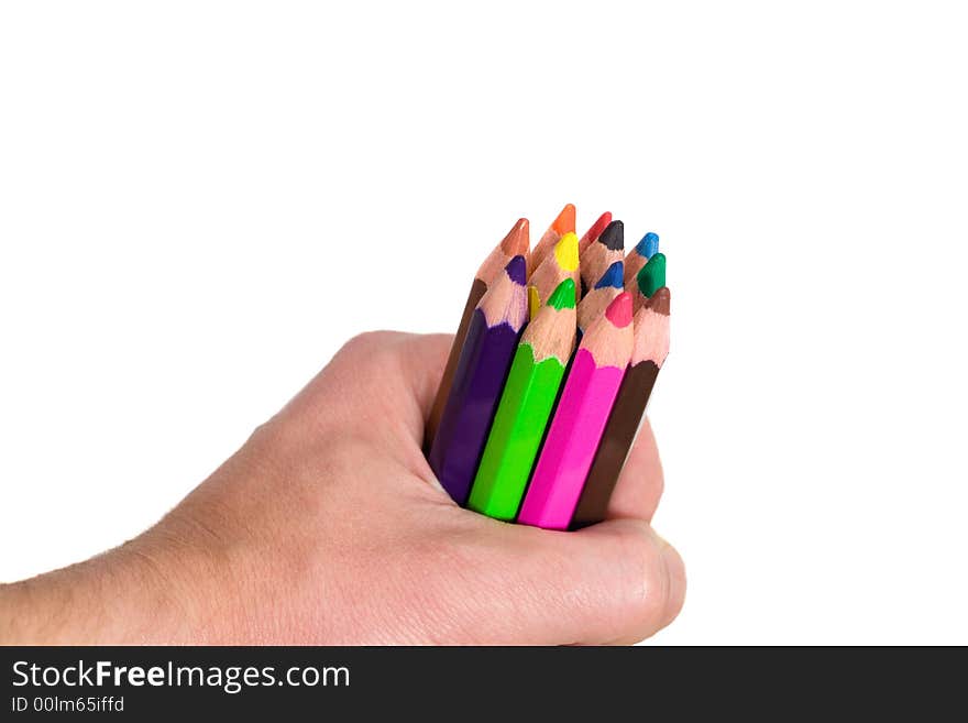 Multi colored pencils in hand on white background. Multi colored pencils in hand on white background