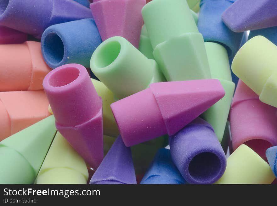 A closeup of a pile of colorful erasers.