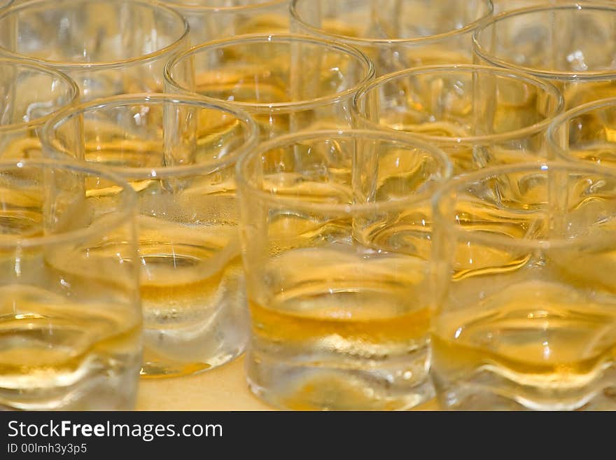 Full whiskey glasses seemles texture background. Full whiskey glasses seemles texture background