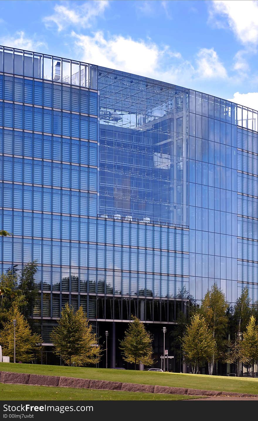 Modern building - city landscape with autumn trees