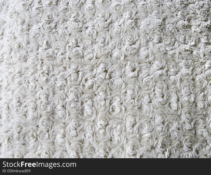 Medium shot photo of curly wool texture. Medium shot photo of curly wool texture