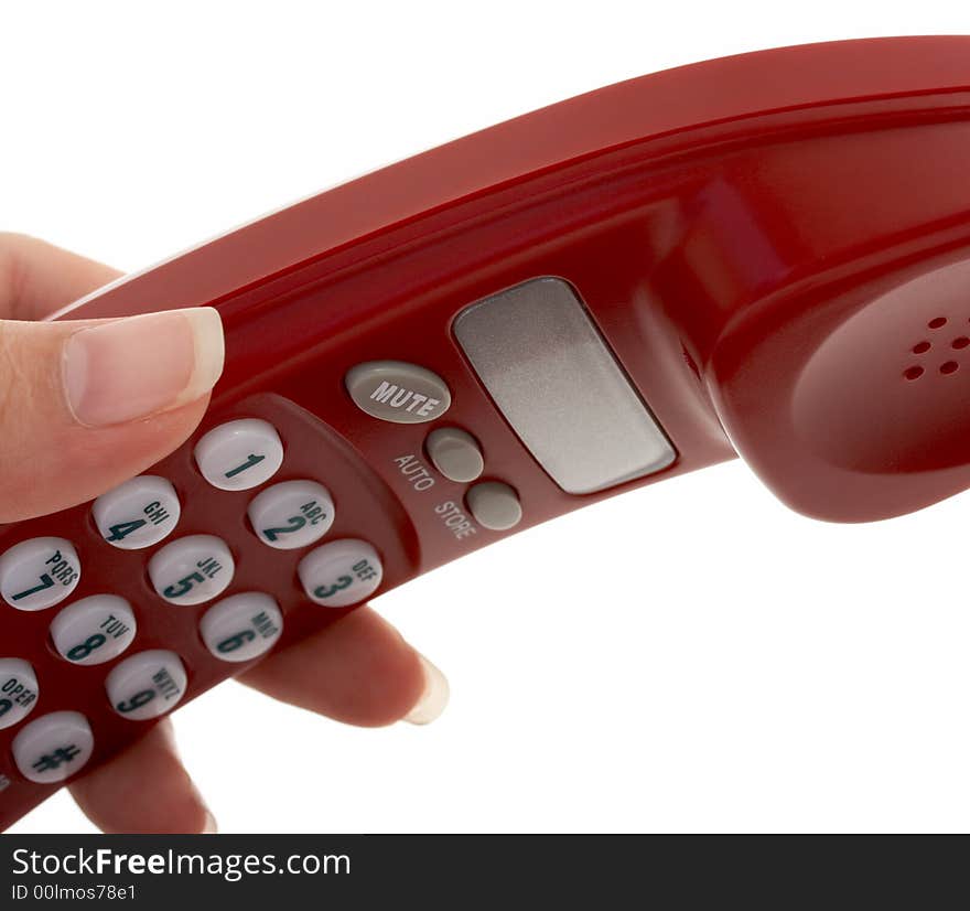 A hand picking up a phone over a white background. A hand picking up a phone over a white background