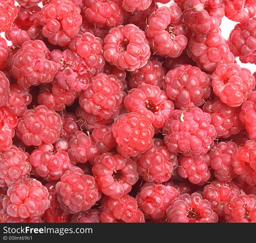 Natural red and fresh raspberry background on the white background. Natural red and fresh raspberry background on the white background