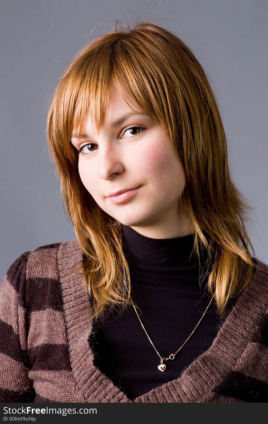 The girl with brown eyes on a grey background