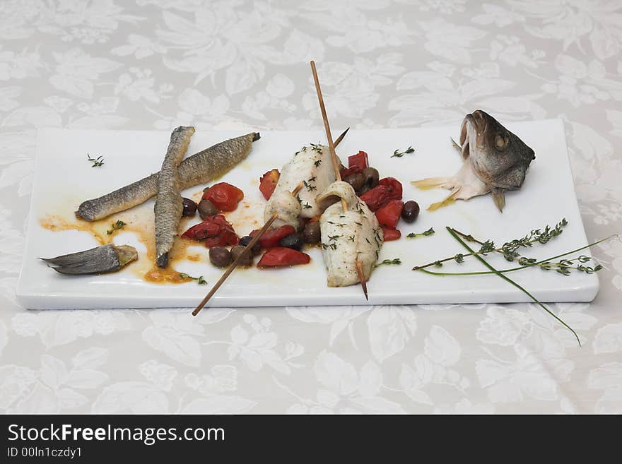 Skewer fish,, branzino italian cooked