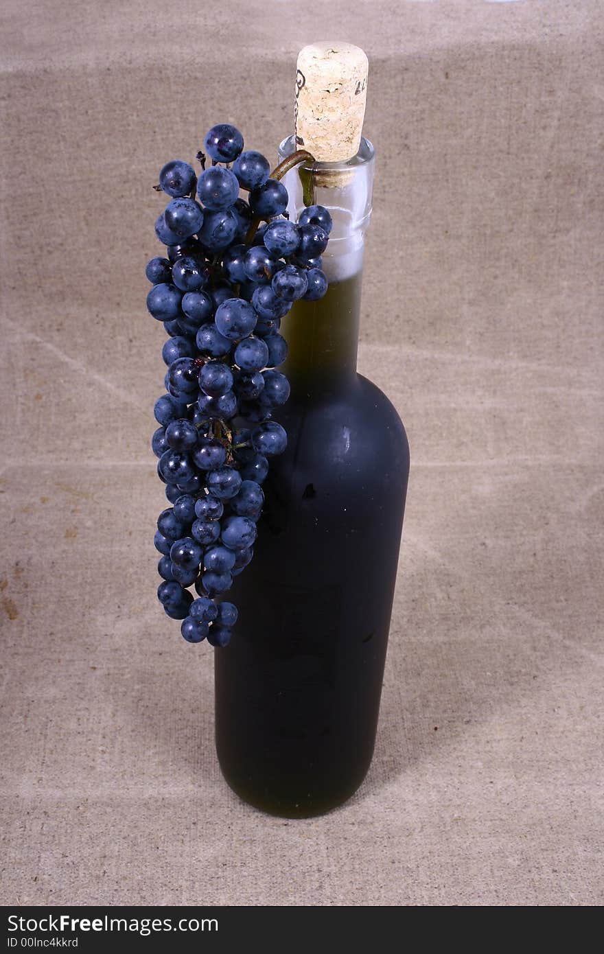 Bottle and grapes isolated on