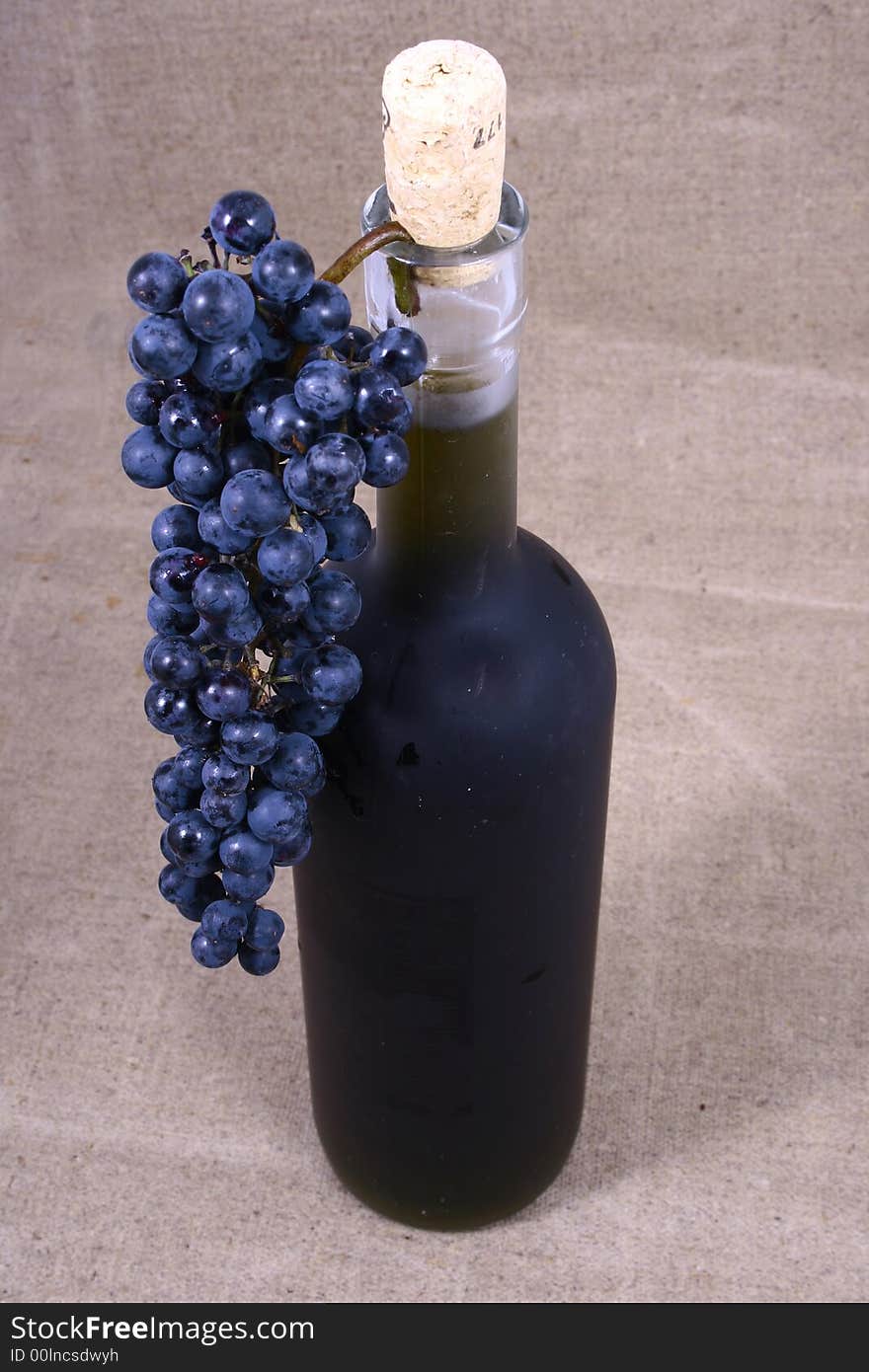 Bottle and grapes isolated on