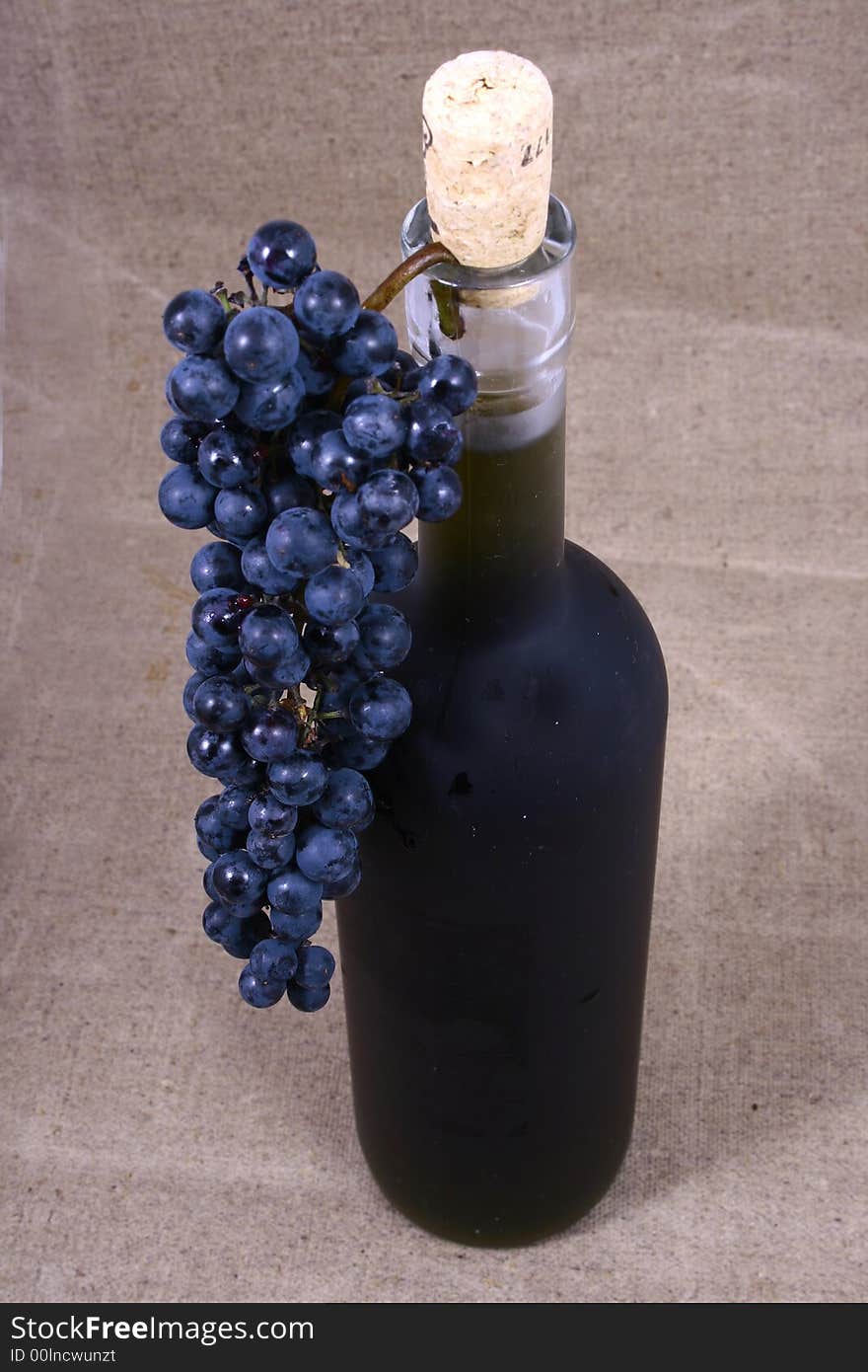 Bottle and grapes isolated on