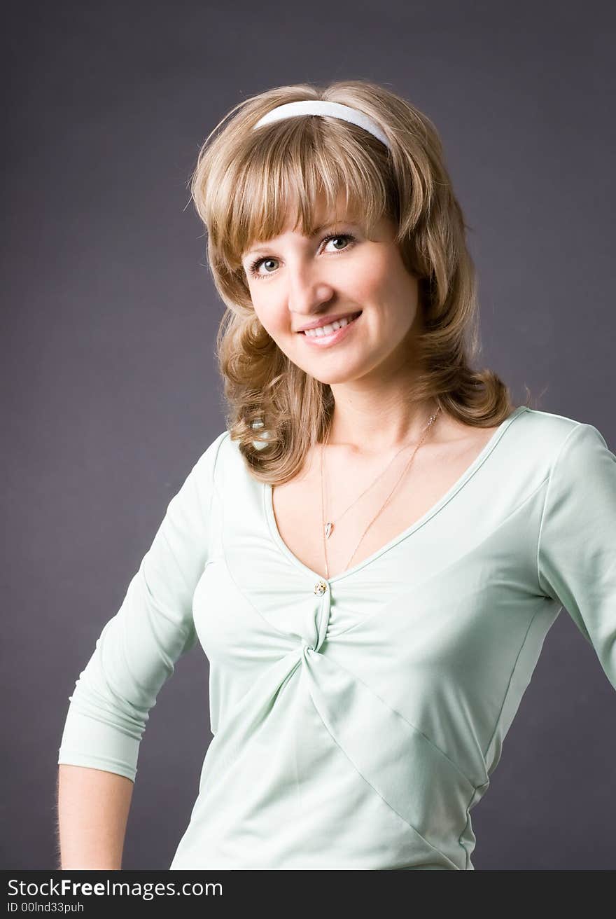 The woman in studio on a grey background. The woman in studio on a grey background