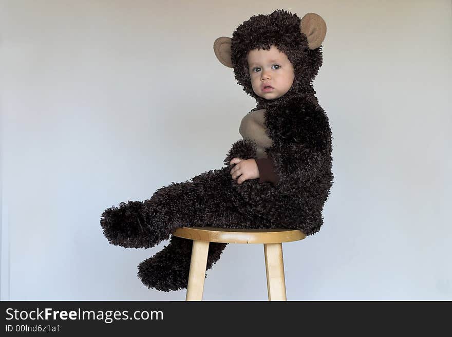 Image of cute toddler wearing a monkey costume. Image of cute toddler wearing a monkey costume