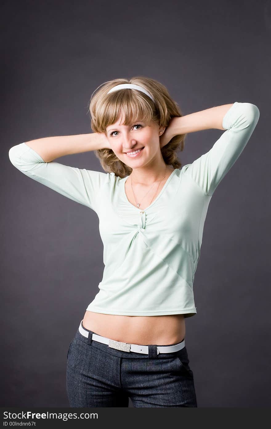 The woman in studio on a grey background. The woman in studio on a grey background