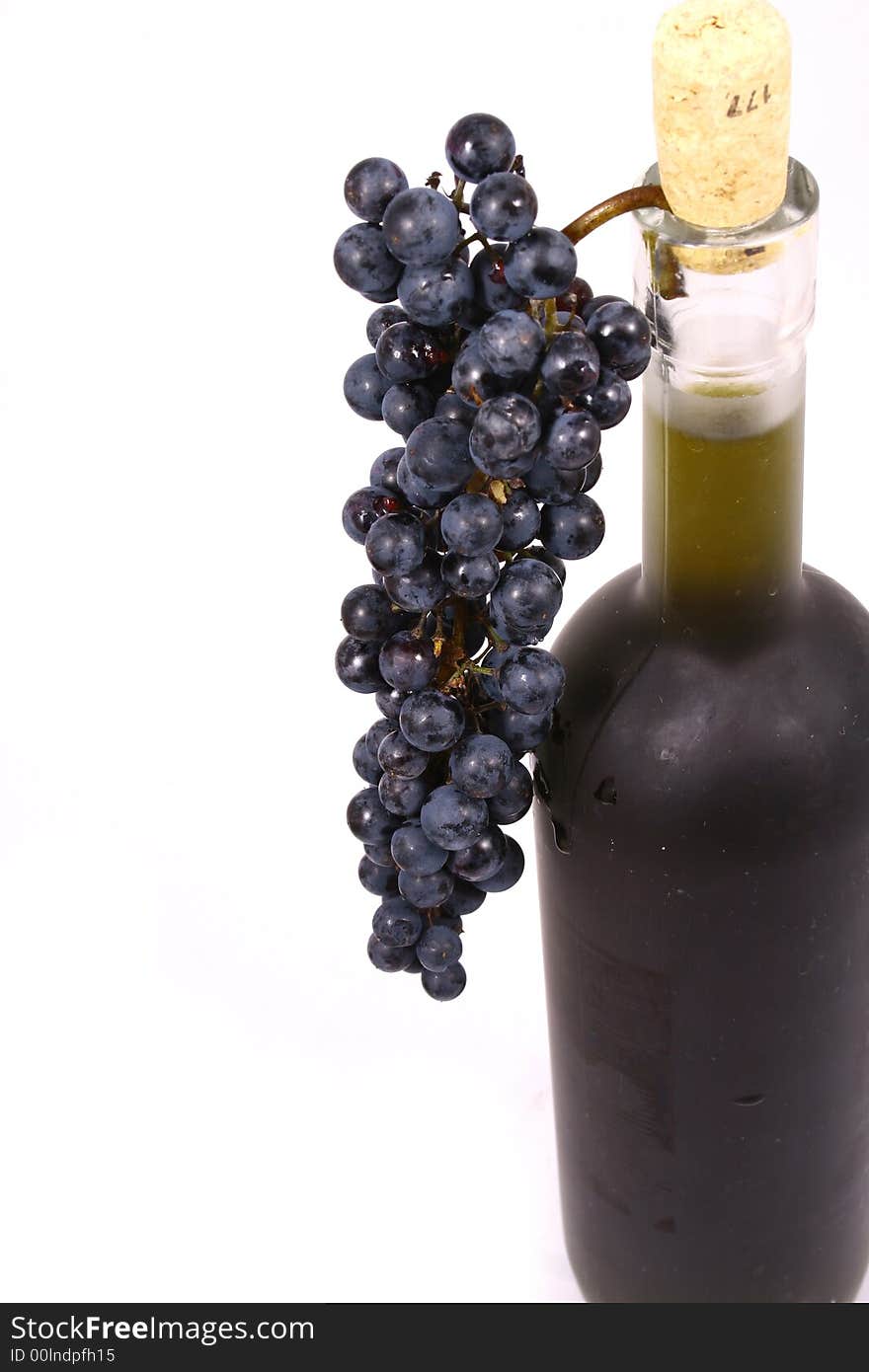 Bottle and grapes isolated on