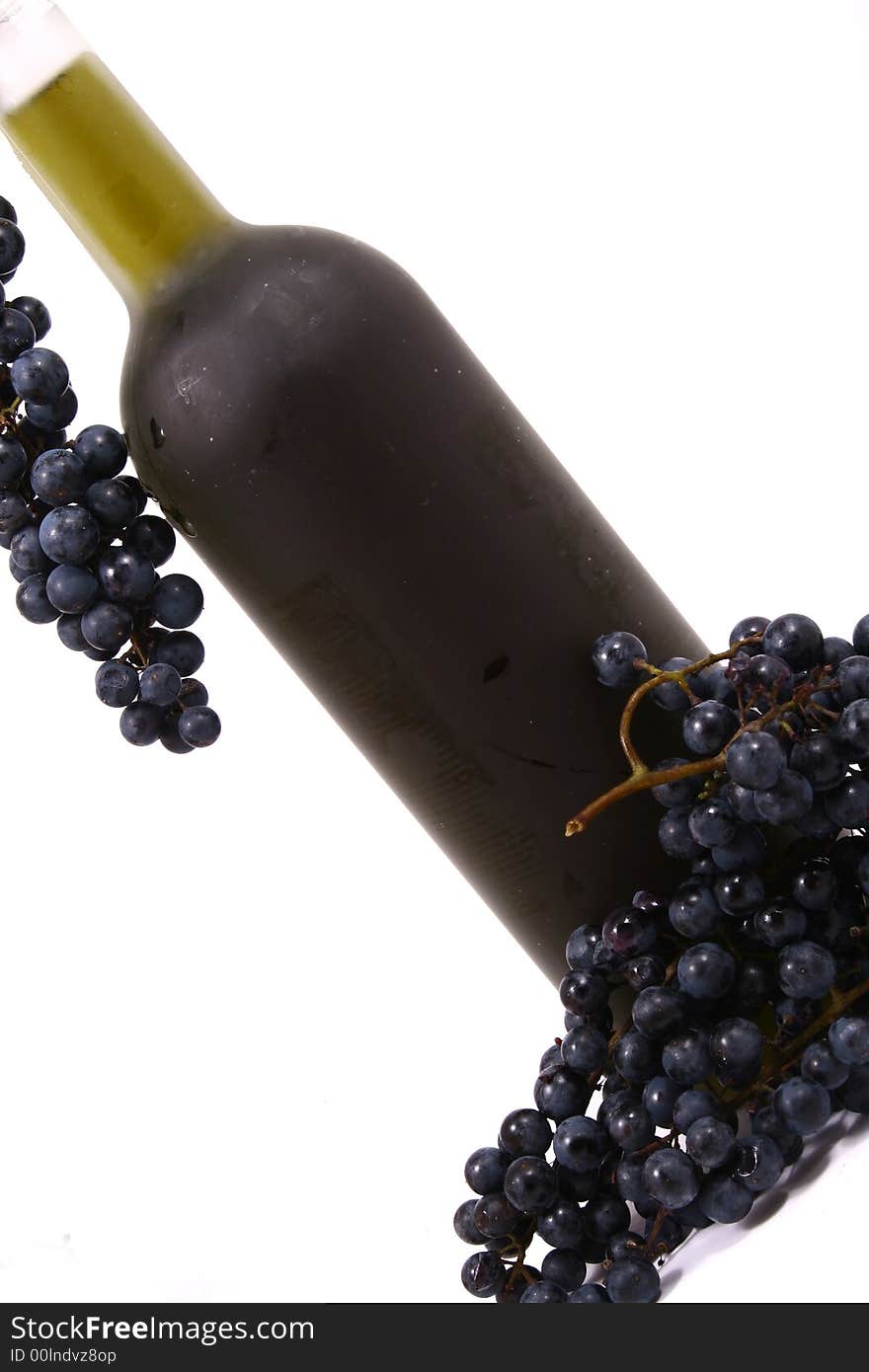 Bottle and grapes isolated on