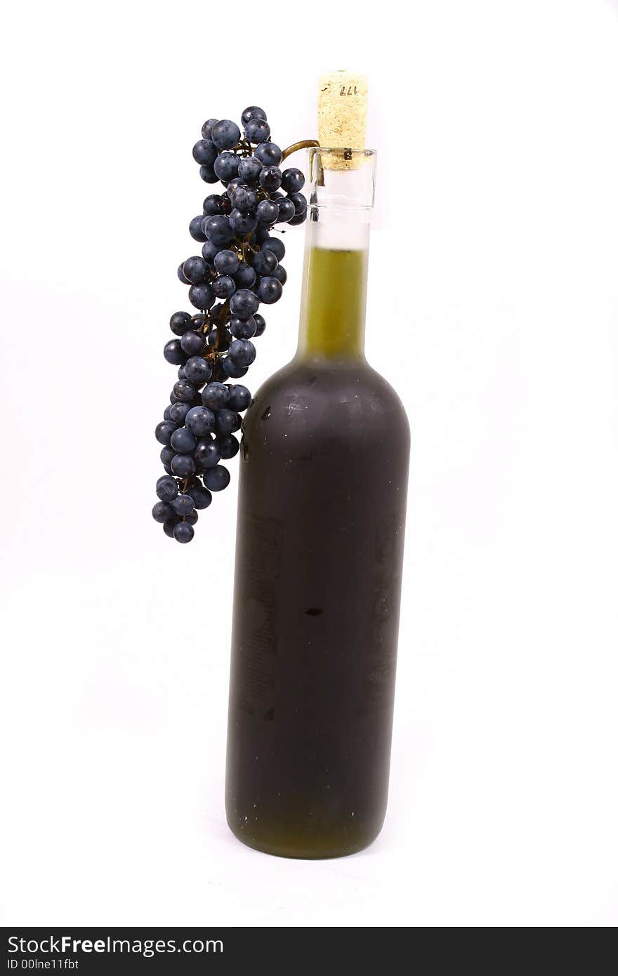 Bottle and grapes isolated on