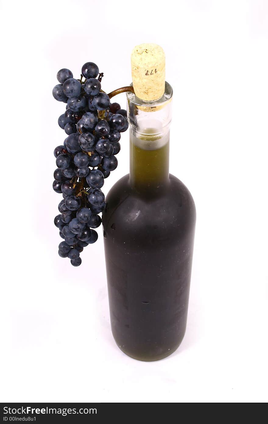 Bottle and grapes isolated on