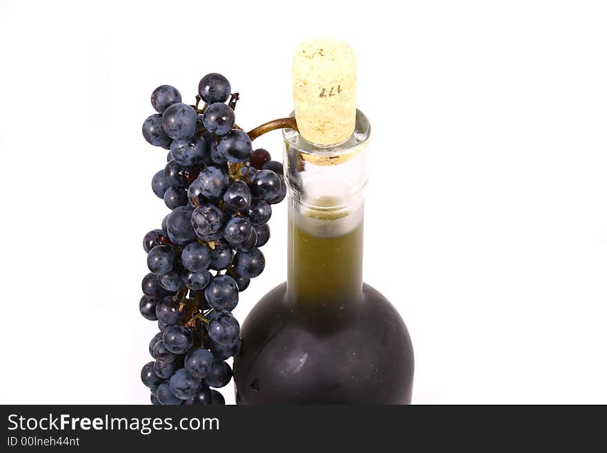 Bottle and grapes isolated on