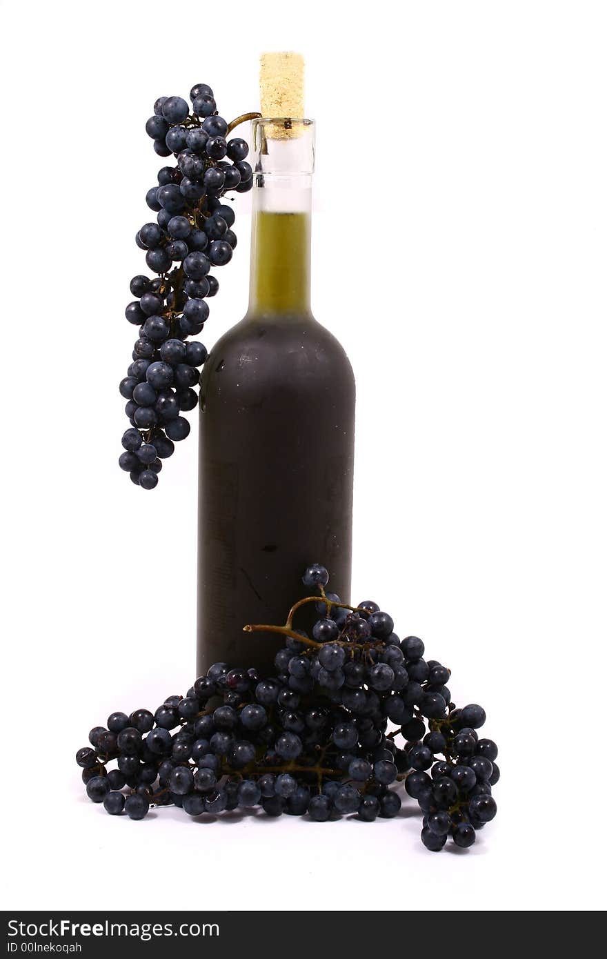 Bottle and grapes isolated on