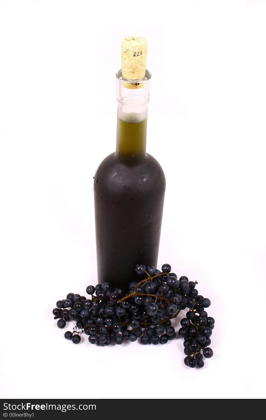 Bottle and grapes isolated on