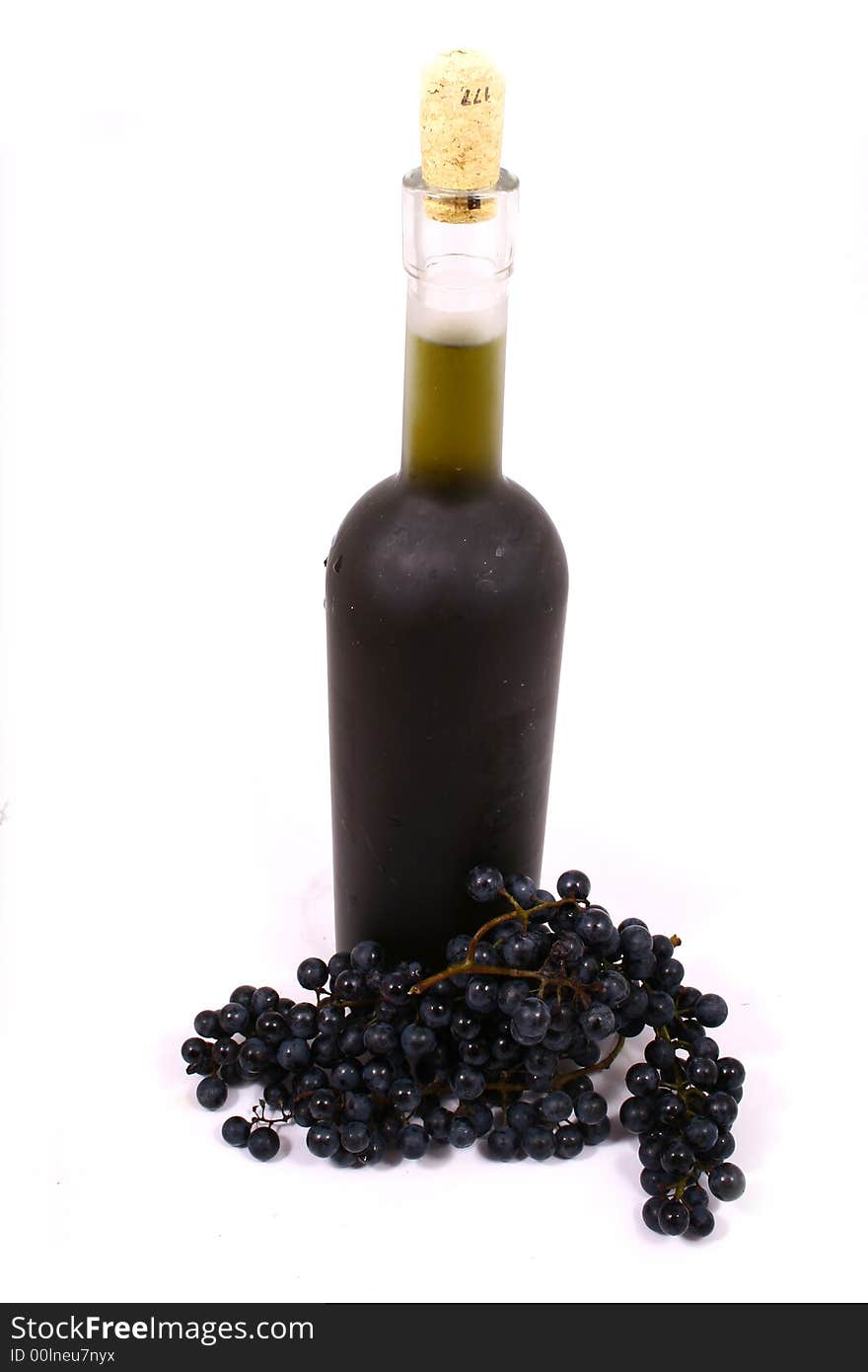 Bottle and grapes isolated on