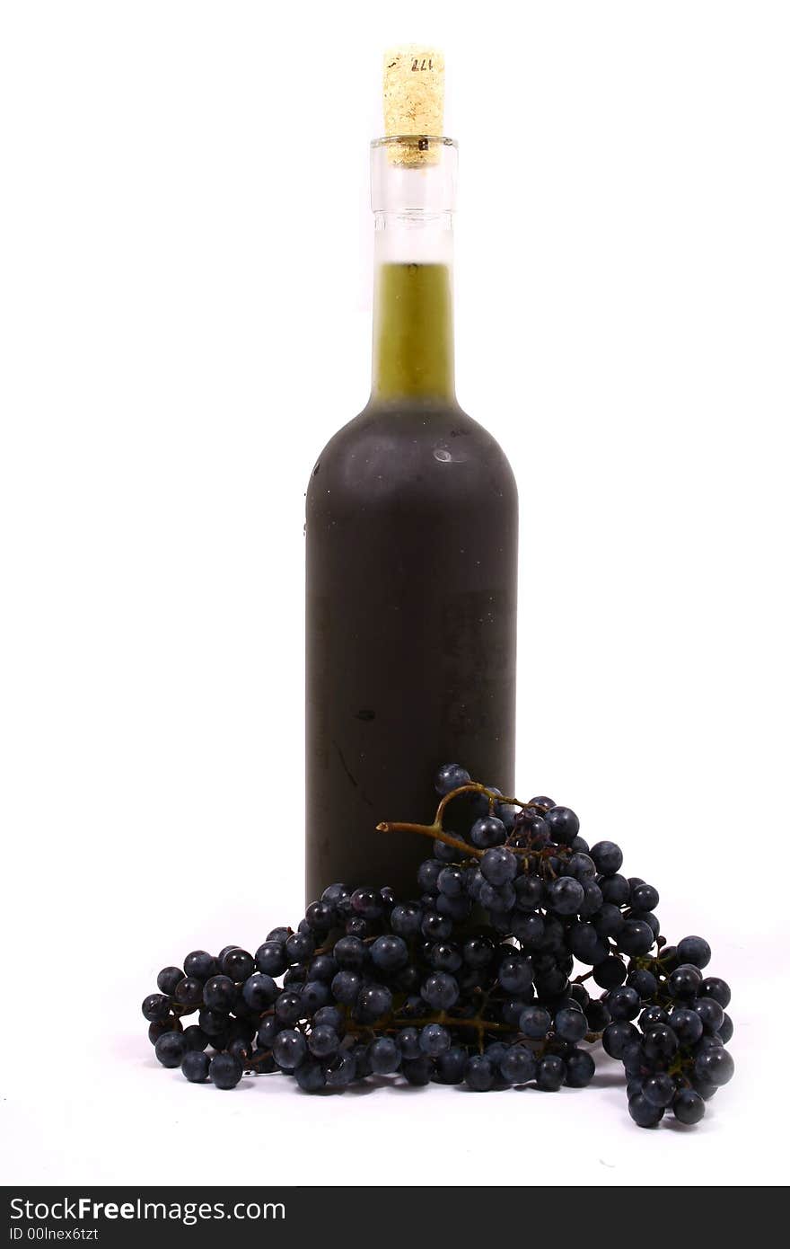 Bottle And Grapes Isolated On