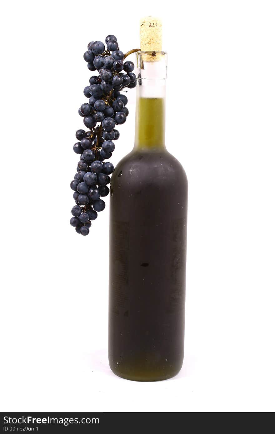 Bottle and grapes isolated on