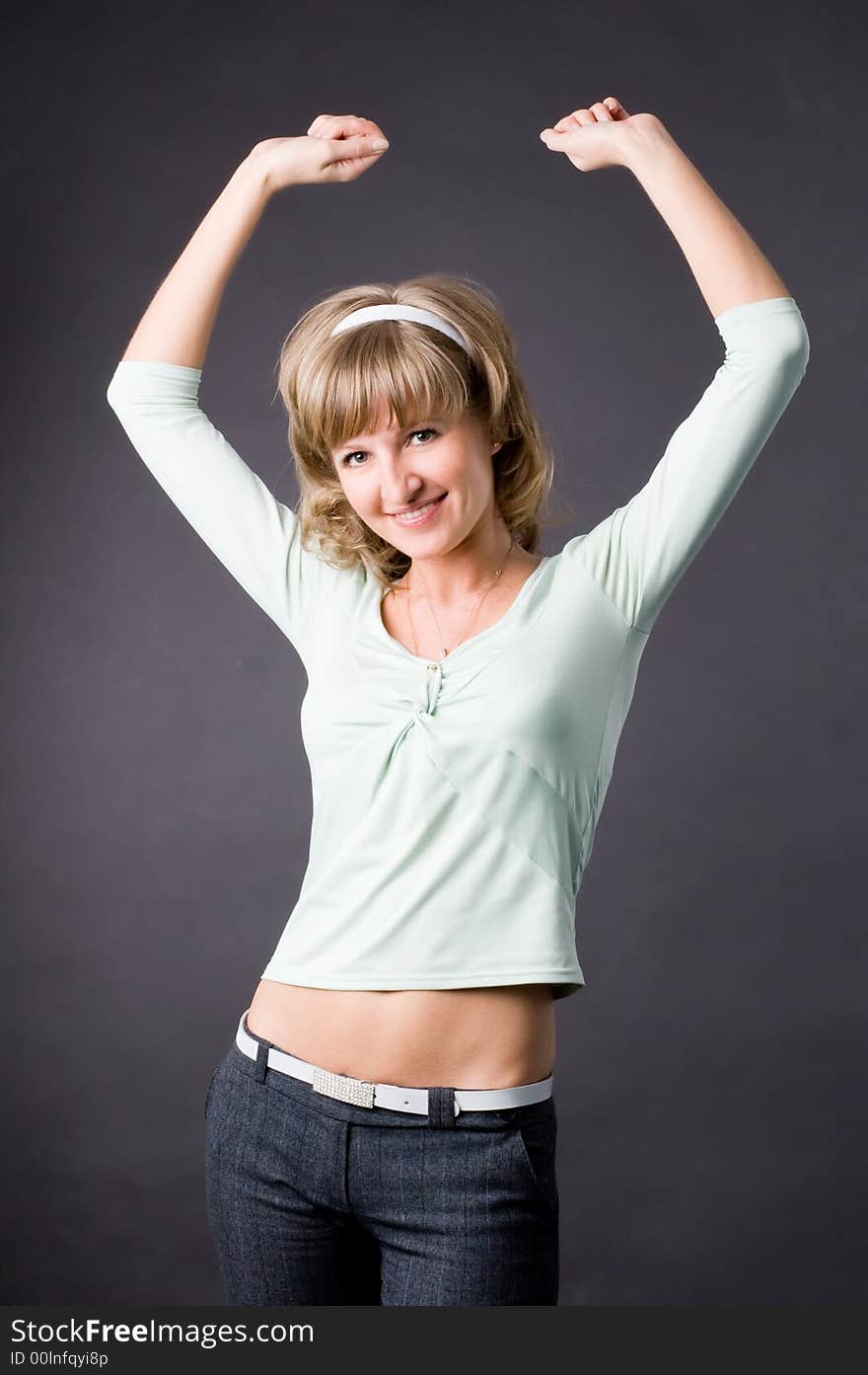 The woman in studio on a grey background. The woman in studio on a grey background